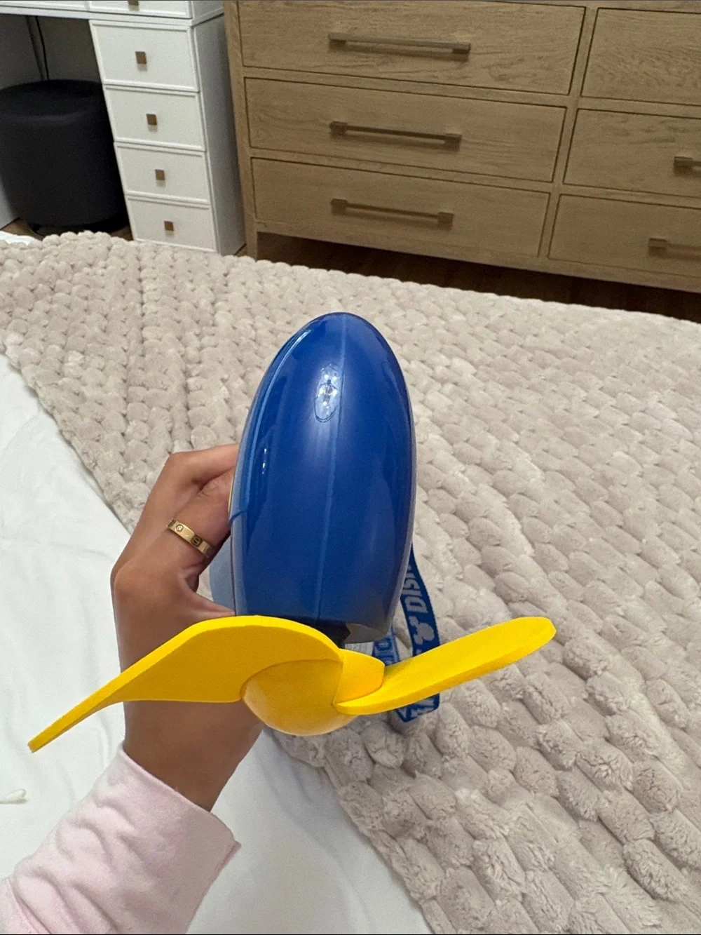 Discontinued Disney Blue Handheld Fan with Yellow Blades and Character Strap